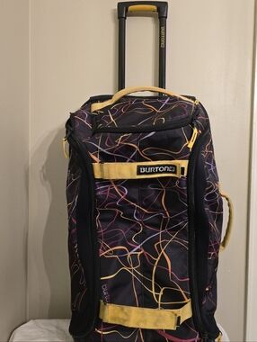 Burton Black Rolling Duffel with Yellow and Multicolor Line Pattern